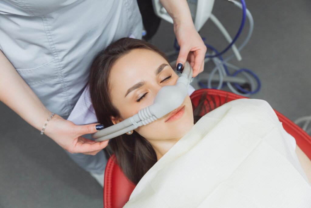 Oral Sedation in Glendale, AZ 1 A female patient wearing a nitrous oxide mask for sedation