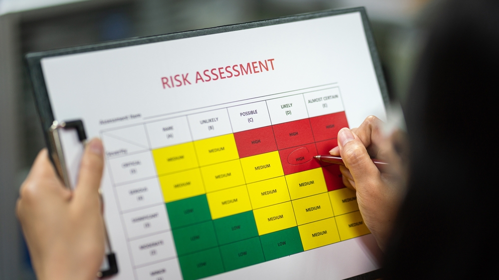 A woman fills out a risk assessment form