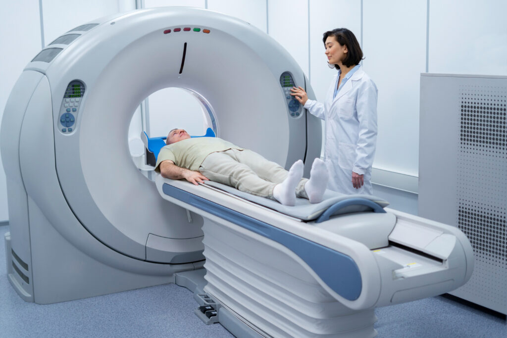 A patient enters a PET scan