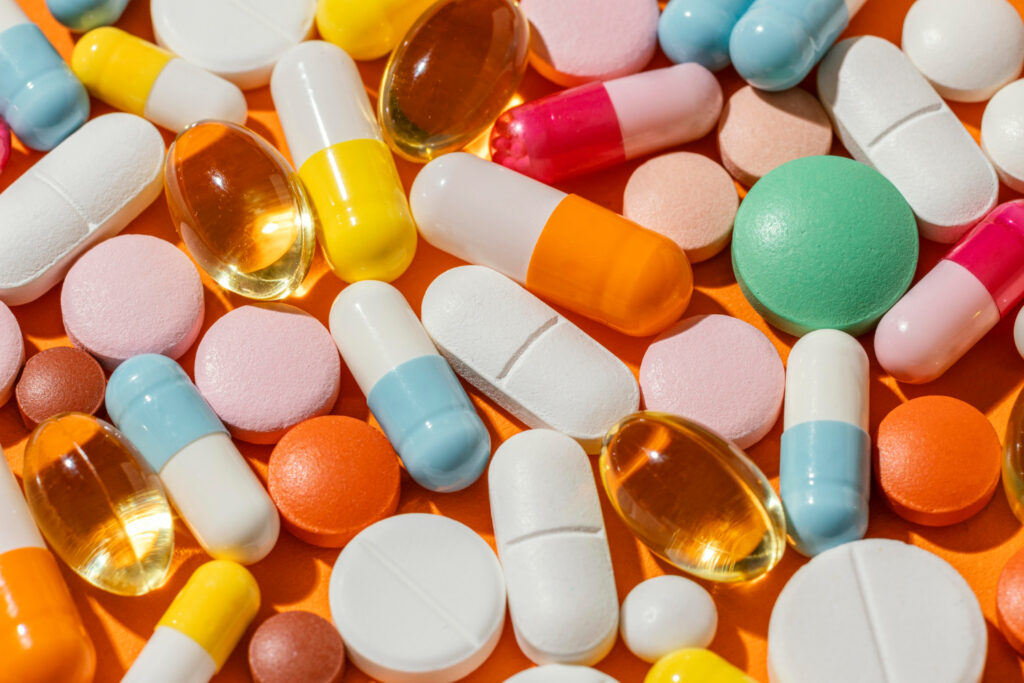 A colorful assortment of medications, pills, and capsules