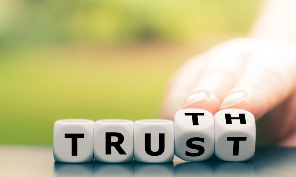 Truth and trust being spelled out by dice
