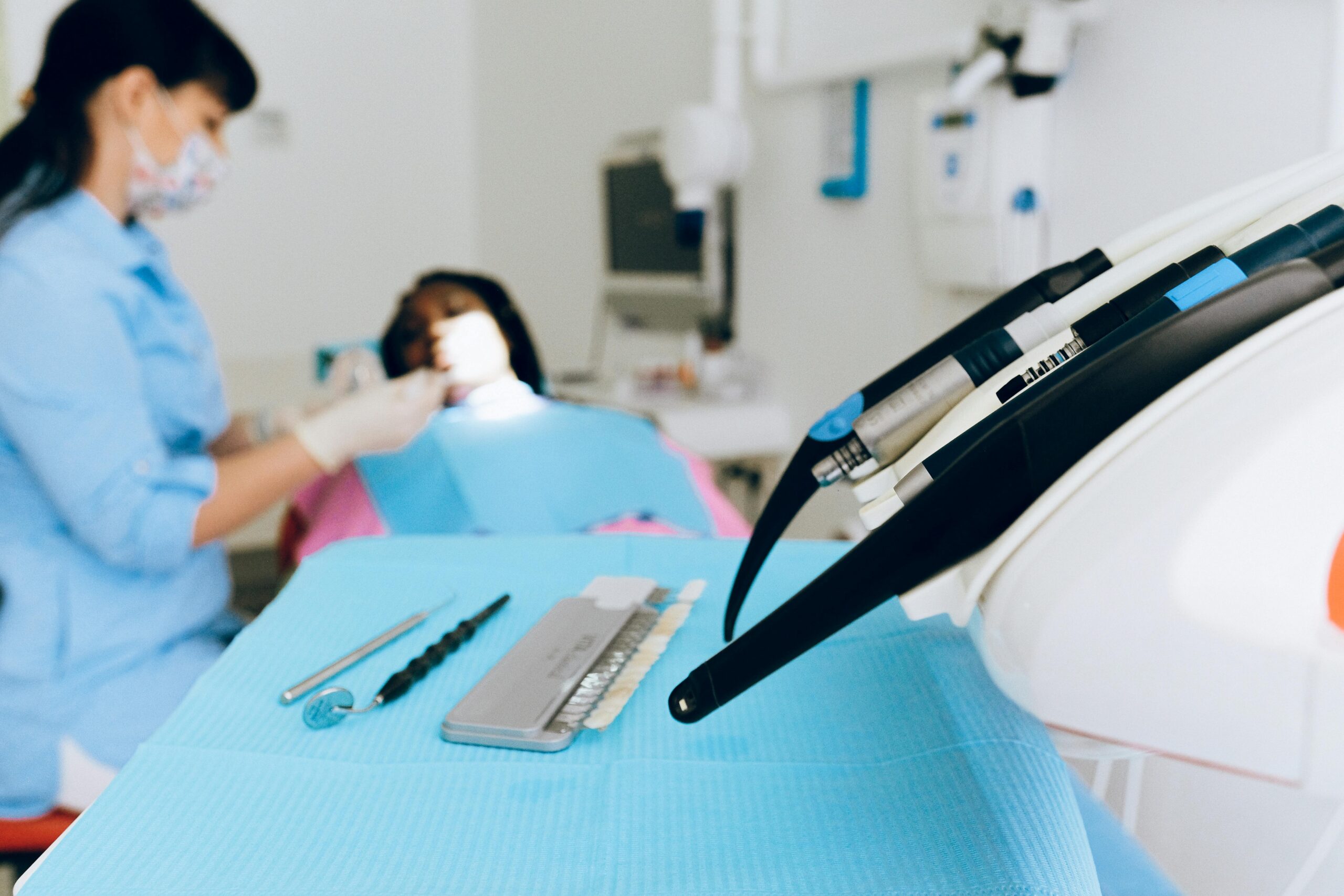 Dental tools and shade guide in a dental office.