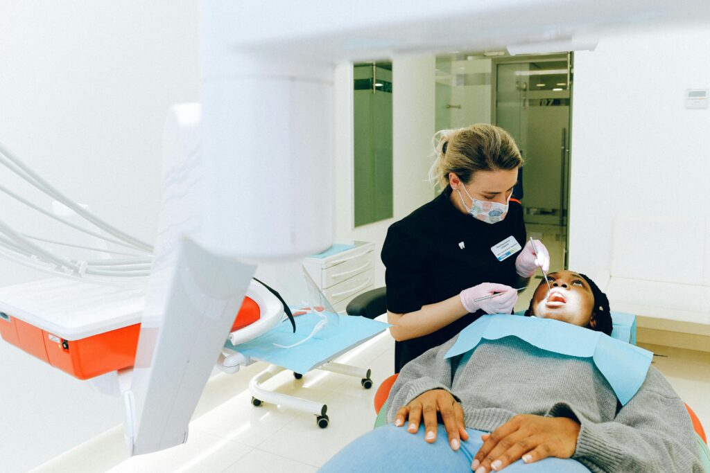 Dentist examining a patient in a dental clinic.