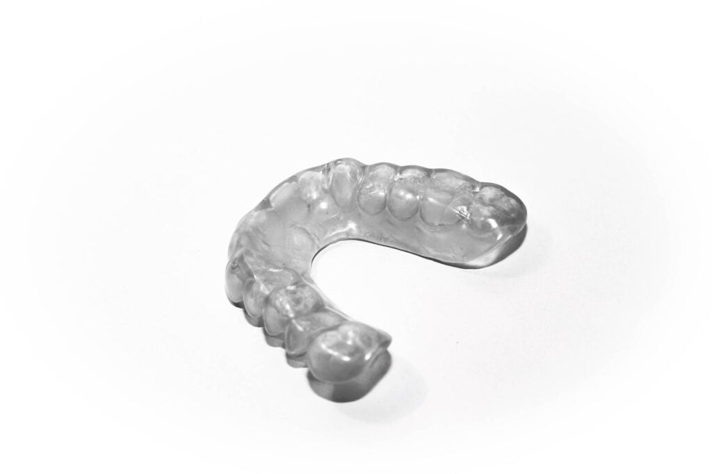 Transparent mouth guard on a white background.
